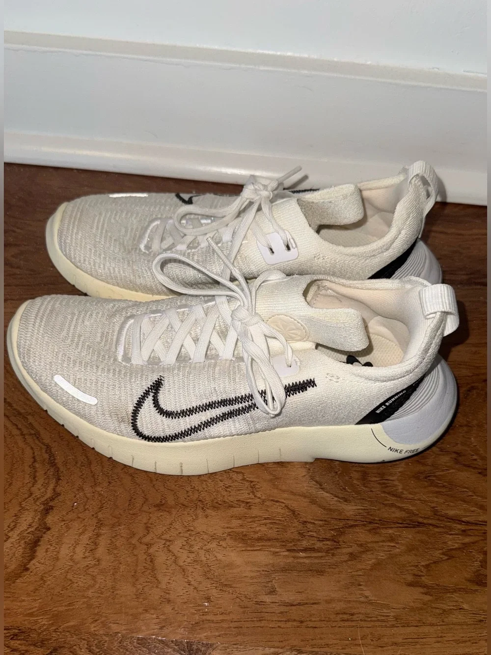 Nike Cream Flyknit Sneakers with Black Swoosh